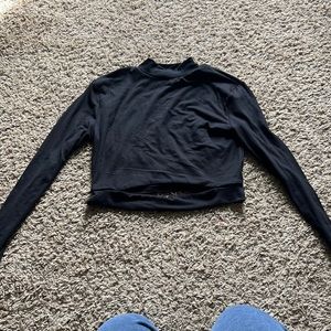 Black cropped long sleeve with slit on stomach. Size M